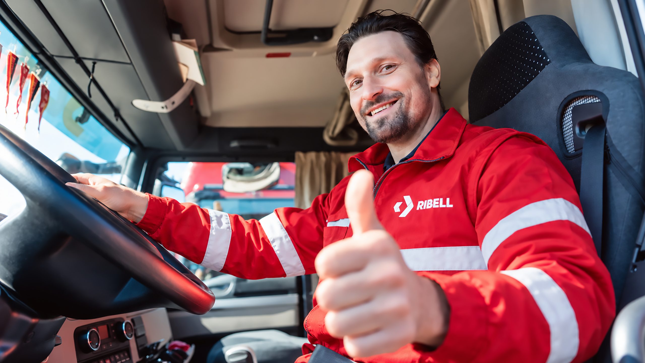 RIBELL driver at the wheel of a tractor unit
